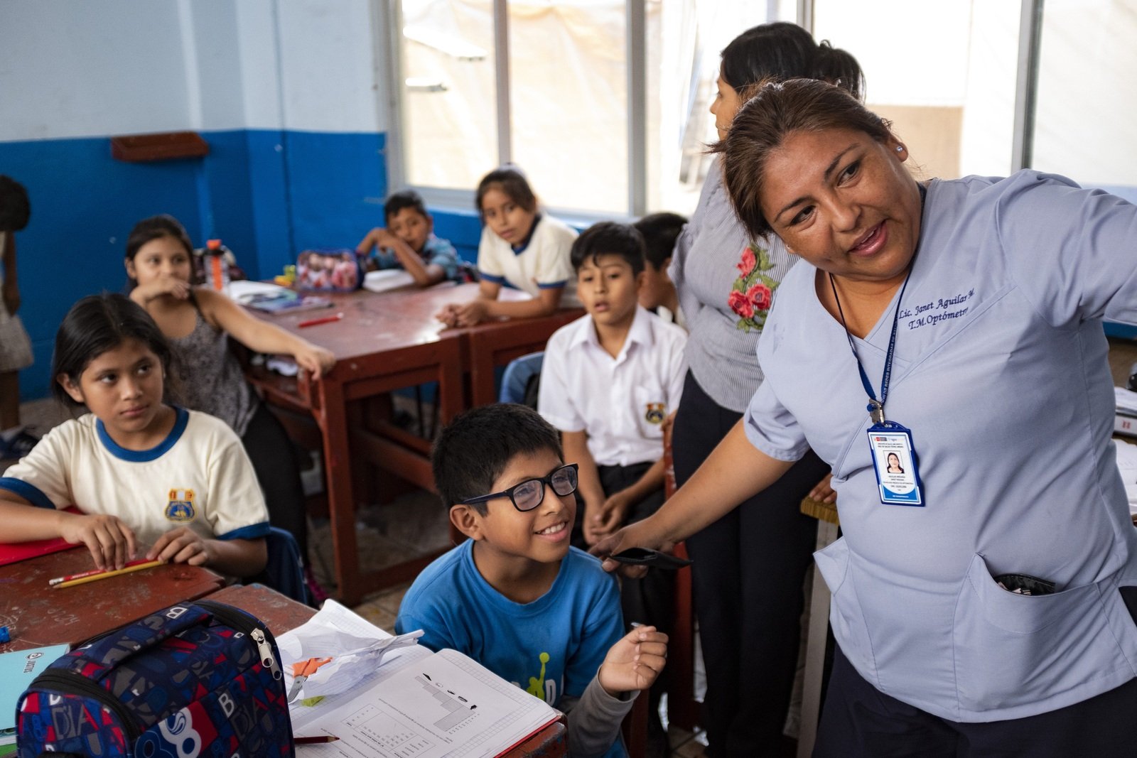 child trying on new glasses